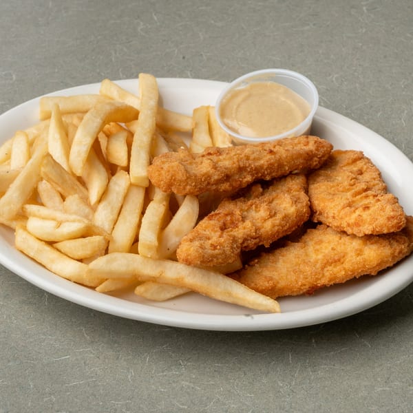 A white oval plate of golden-brown chicken tenders, french fries, and a side of dipping sauce.